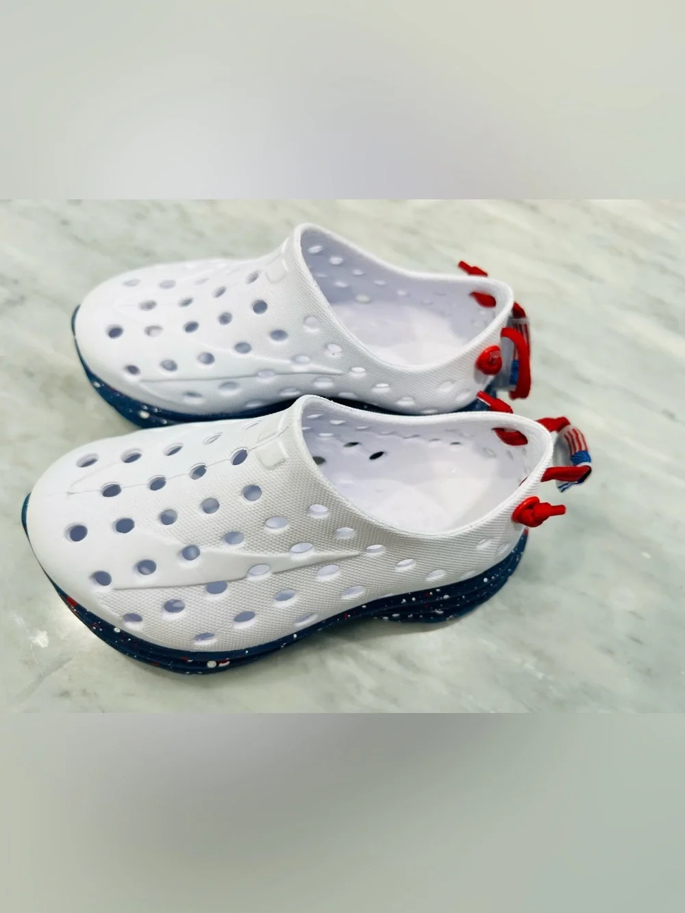 Kids White Slip-On Water Shoes with Navy Speckled Sole and Red Pull Tab